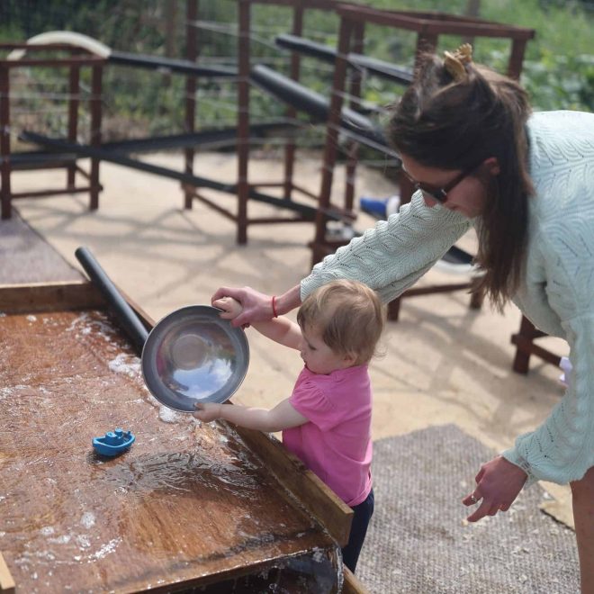 Water play activity at Playful Paths outdoor adventure park, perfect for kids' fun and exploration.